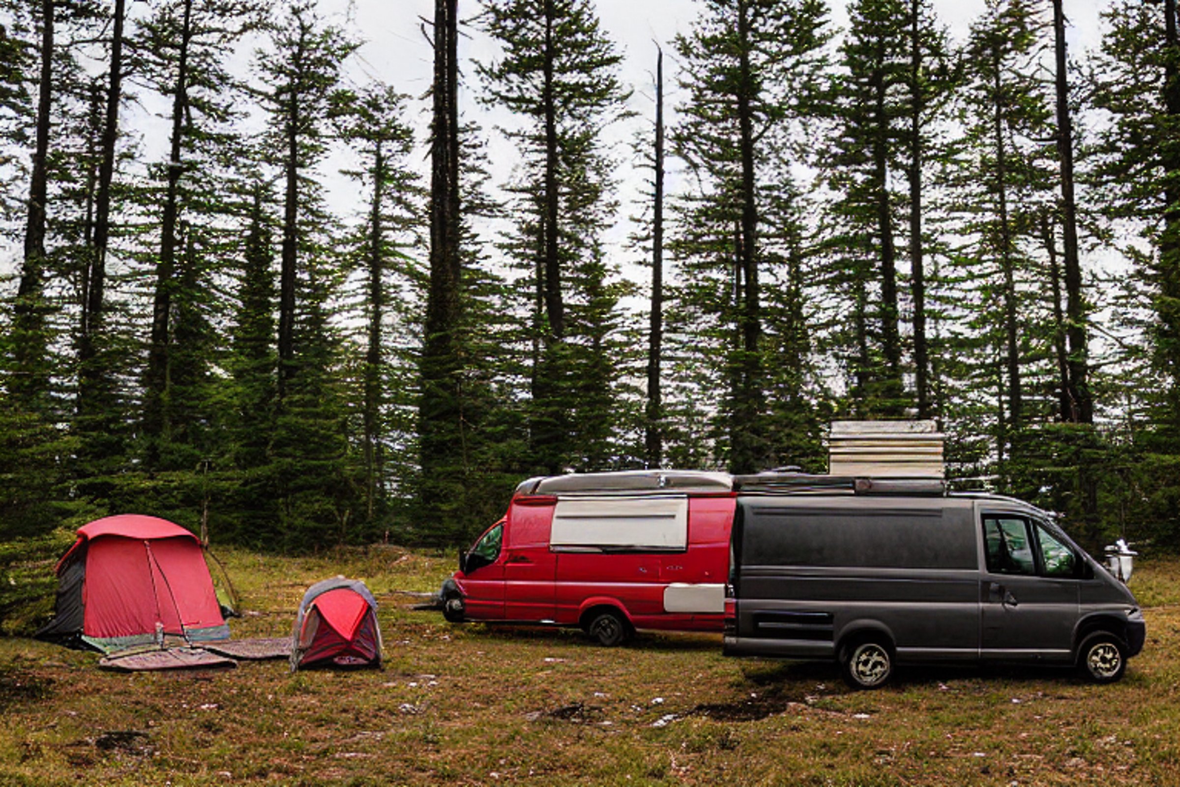 A red camper van rests on a quiet dirt campsite beneath a clear night sky. A guitar and camping gear sit near the large stone slabs, while a deer watches from the distance.