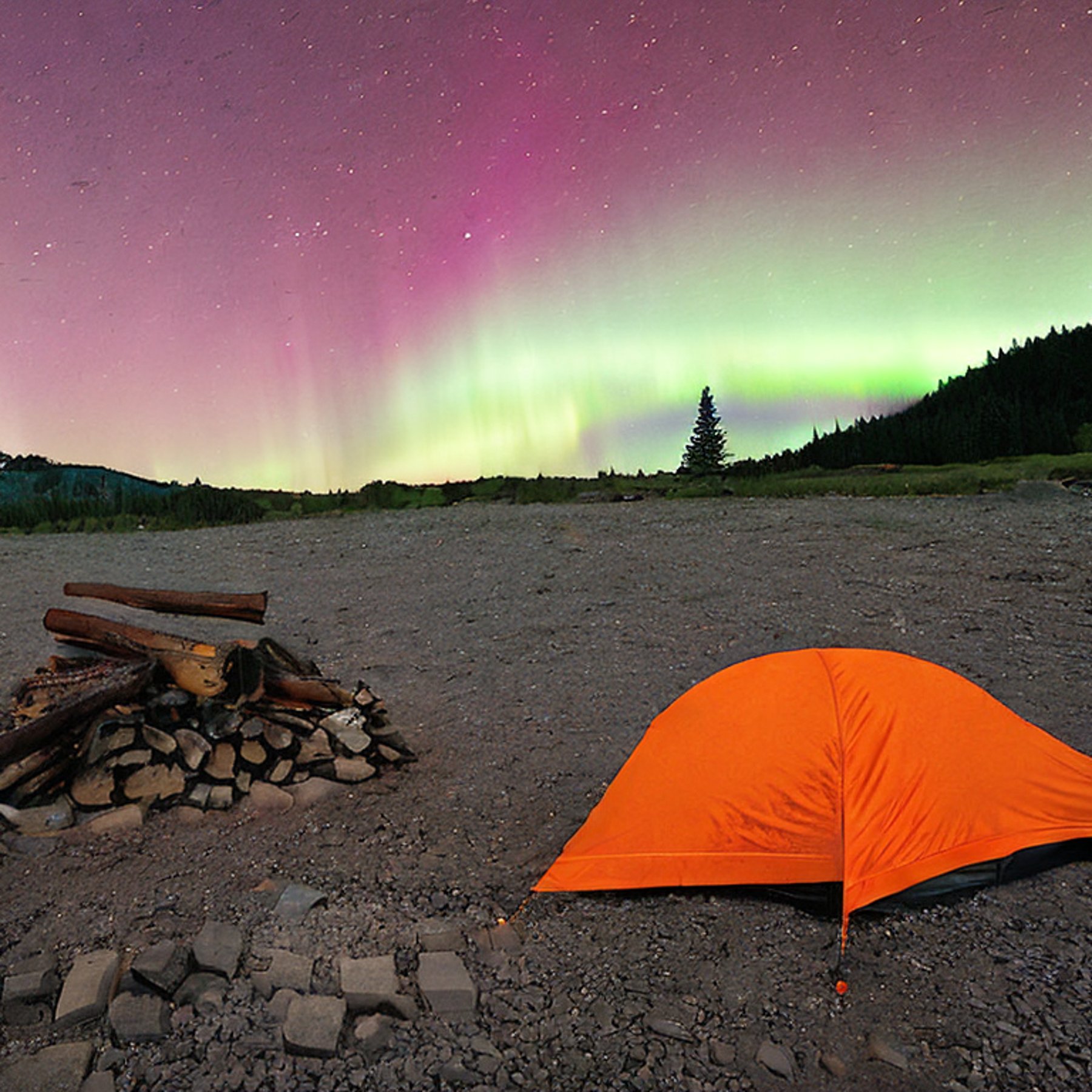 A gray and orange tent rests on a quiet campsite beneath glowing northern lights. A warm campfire burns among the stones, with a dirt path and scattered leaves nearby.