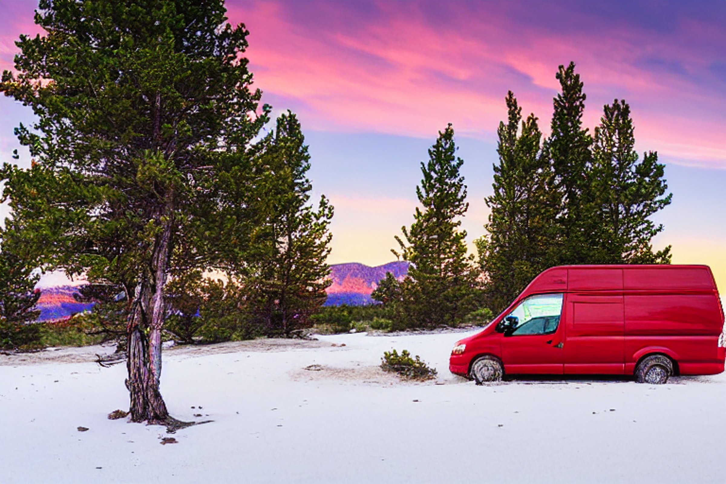 A red and white camper van rests beside a warm campfire as the sun sets over the snowy sand dunes. Small trees, a picnic table, and a hammock create a cozy spot along the dirt path.