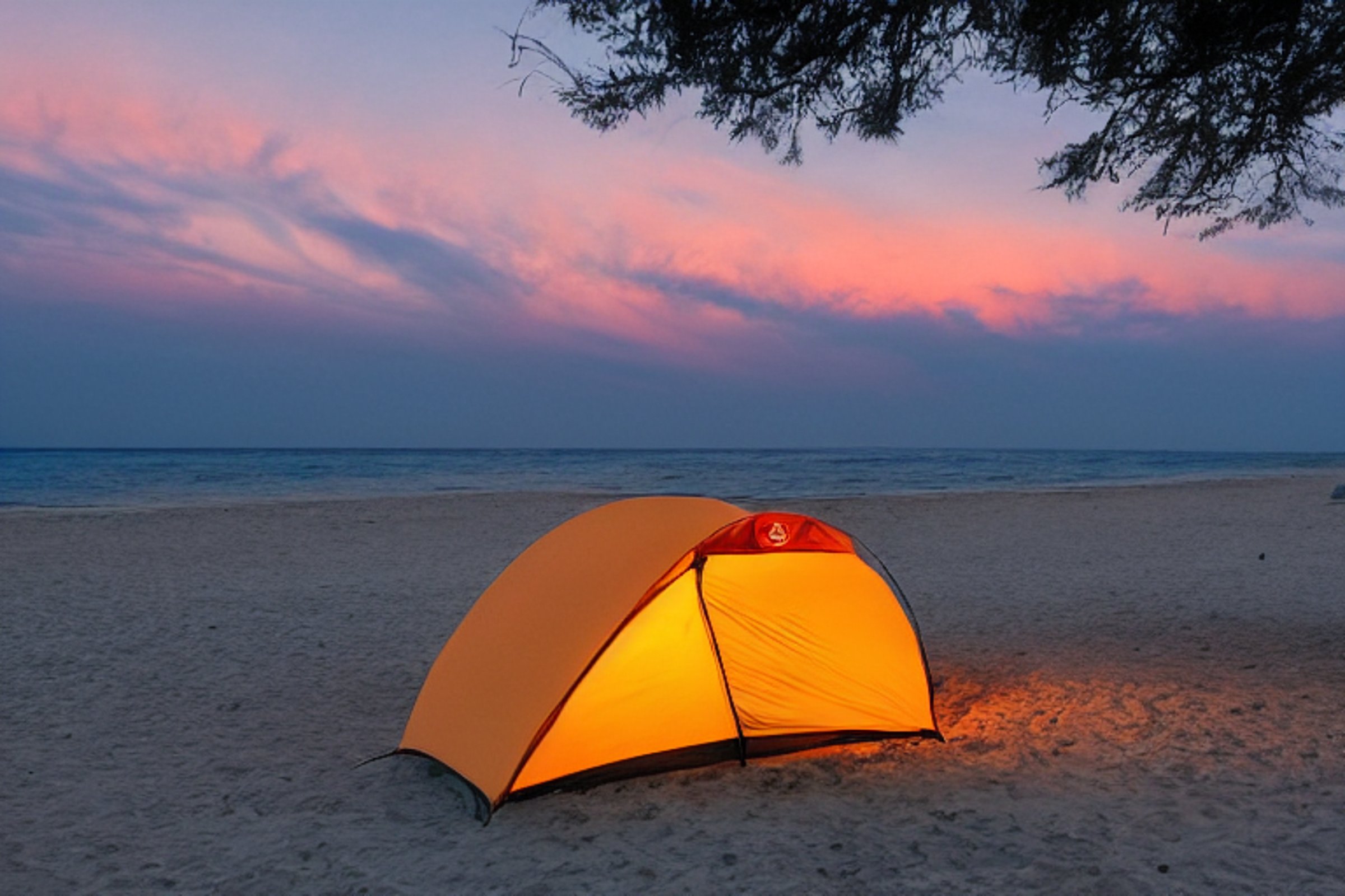 Tent at campsite on a beach during sunset