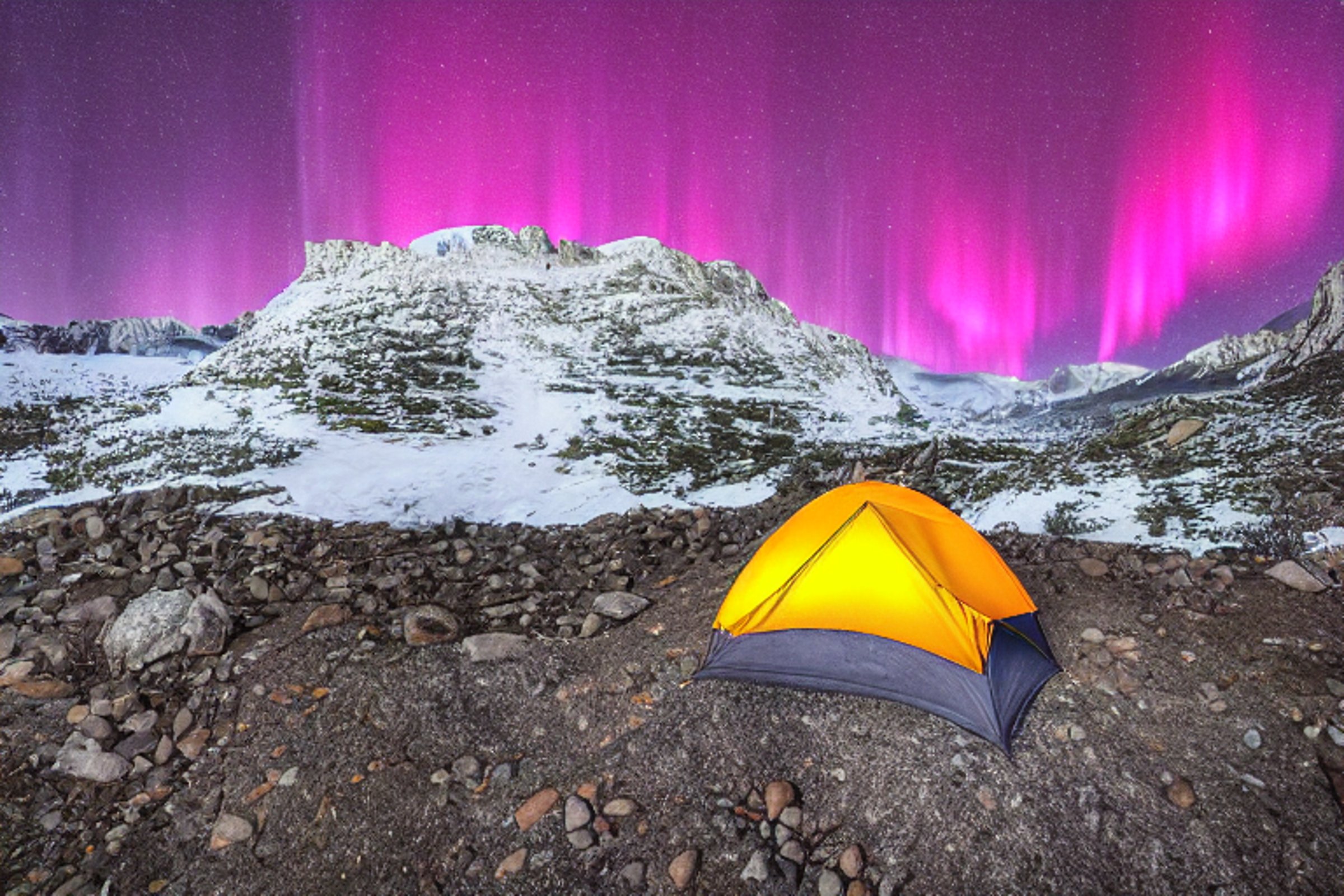 A cozy tent glows beside a warm campfire on a snowy mountain. Bright northern lights dance across the night sky, while flowers, boulders, and gravel surround the campsite.