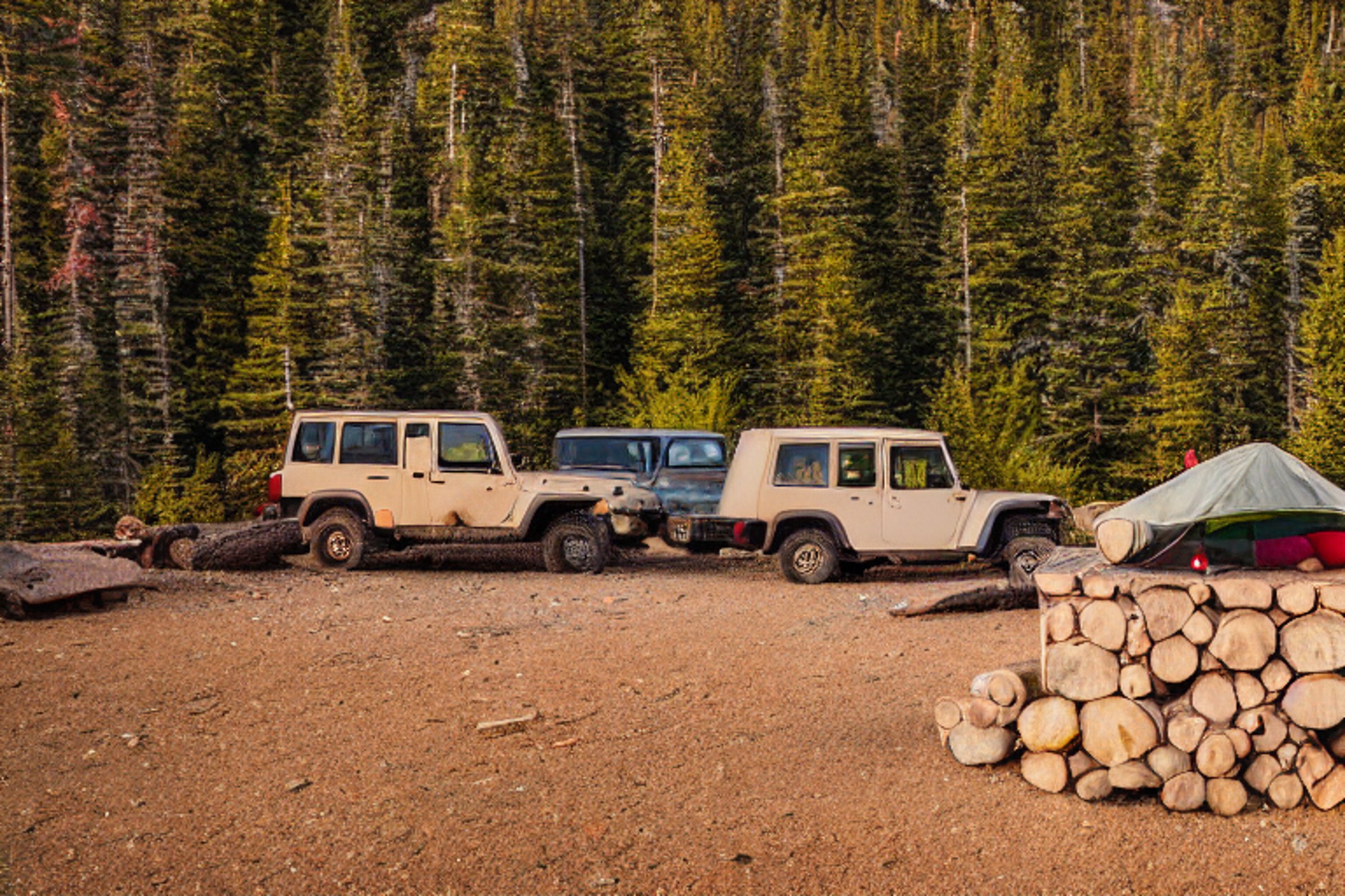 A forest-green Jeep with a rooftop tent rests in a quiet dirt campsite. Fall trees and large bushes surround a warm campfire beneath the glowing northern lights. Light rain adds a peaceful, cozy feeling.